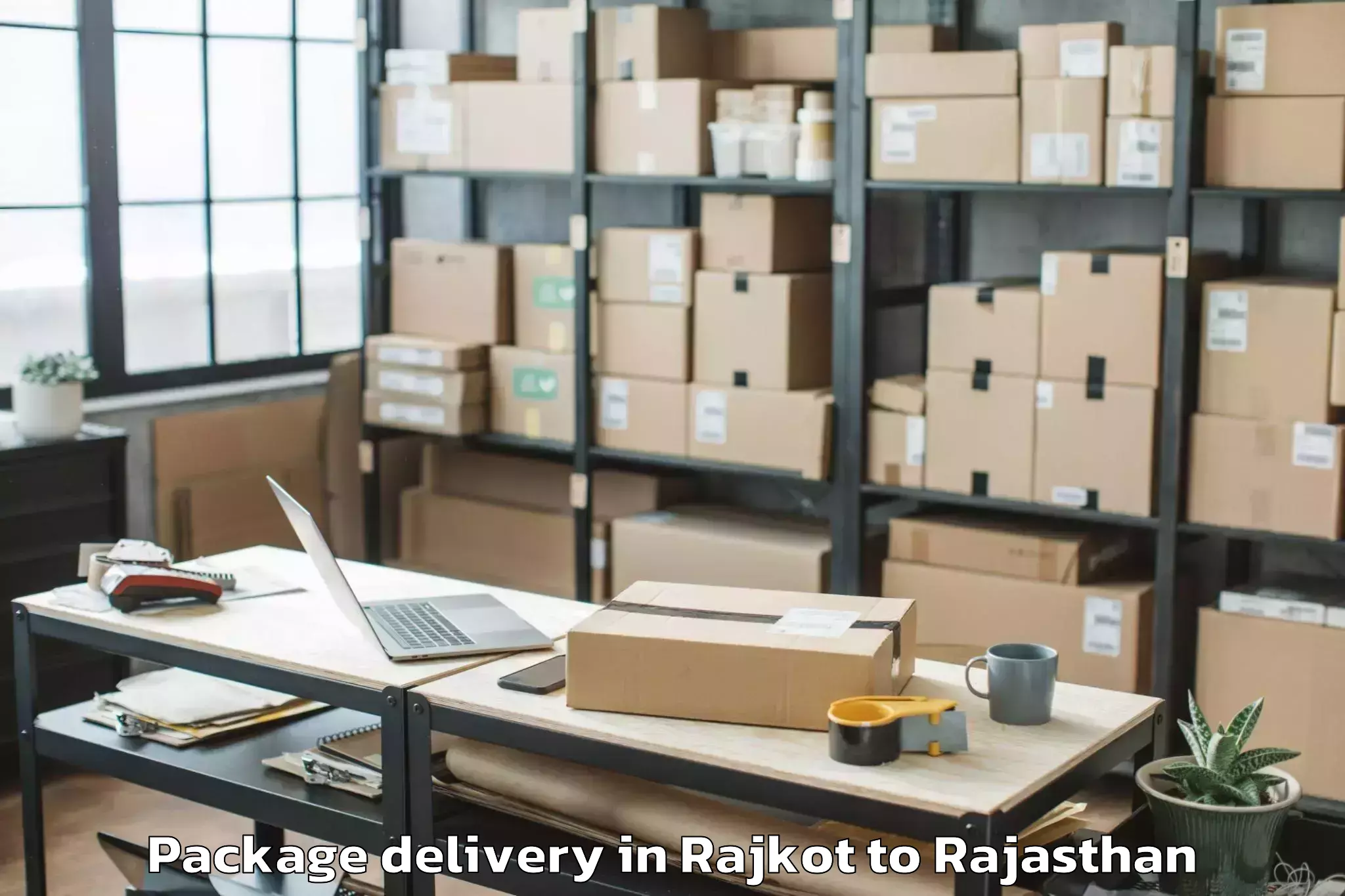 Trusted Rajkot to Central University Of Rajastha Package Delivery